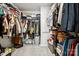 Walk-in closet with ample storage, including shelving, rods, and shoe racks at 5008 Calvine Mill Way, Charlotte, NC 28205