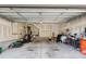 Spacious two car garage with unfinished walls, and visible lighting and storage capacity for vehicles and storage at 5008 Calvine Mill Way, Charlotte, NC 28205