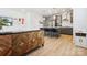 Open-concept kitchen featuring a large center island, stainless steel appliances, and stylish pendant lighting at 5008 Calvine Mill Way, Charlotte, NC 28205