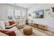 Bright living room with large windows, plush seating, and a modern entertainment center at 5008 Calvine Mill Way, Charlotte, NC 28205