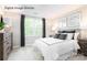 Bright bedroom with large window, modern furniture, and neutral decor at 5213 Crimson Kate Ln # 2007B, Charlotte, NC 28208