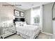 Bright bedroom featuring natural light, neutral paint, and modern decor at 5213 Crimson Kate Ln # 2007B, Charlotte, NC 28208