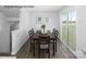 Dining room with wood floors and sliding glass door to the outside deck at 5213 Crimson Kate Ln # 2007B, Charlotte, NC 28208