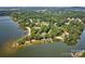 Beautiful aerial view of the lakefront property, boasting a private dock and lush surroundings for serene living at 5390 Hudson Rd, Clover, SC 29710