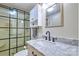 Modern bathroom featuring a marble countertop, updated fixtures, and a glass-enclosed shower at 5390 Hudson Rd, Clover, SC 29710
