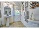 Basement bathroom featuring a pedestal sink, toilet, and decorations at 5390 Hudson Rd, Clover, SC 29710