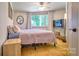 Cozy bedroom featuring a comfortable bed, a TV, and plenty of natural light at 5390 Hudson Rd, Clover, SC 29710