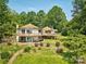 Unique multi-story home with private balconies, beautiful landscaping, and lush surroundings at 5390 Hudson Rd, Clover, SC 29710