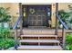 Welcoming front porch featuring double doors, rocking chairs, and decorative plants for a cozy entrance at 5390 Hudson Rd, Clover, SC 29710