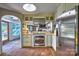 Modern kitchen with stainless steel appliances and tiled floors opening up to the living area at 5390 Hudson Rd, Clover, SC 29710