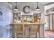 Kitchen bar overlooking the kitchen with a decorative C hanging overhead at 5390 Hudson Rd, Clover, SC 29710