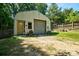 Versatile outbuilding with garage door, offering additional storage or workshop space on the property at 5390 Hudson Rd, Clover, SC 29710