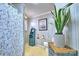 Compact bathroom features a shower, toilet, patterned wallpaper, and neutral tones at 5390 Hudson Rd, Lake Wylie, SC 29710