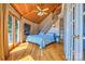 Cozy bedroom with hardwood floors, vaulted ceiling, a private balcony, and exterior door at 5390 Hudson Rd, Lake Wylie, SC 29710