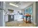 Bright kitchen features white cabinets, modern appliances, and a view of the garden at 5390 Hudson Rd, Lake Wylie, SC 29710