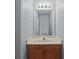 Well lit bathroom with a single sink vanity and recessed lighting at 5724 Cougar Ln, Charlotte, NC 28269