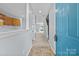 Inviting entryway with tile flooring, staircase, and view to the open living area at 5724 Cougar Ln, Charlotte, NC 28269