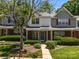 Traditional brick-front home with lush landscaping, mature trees, and inviting curb appeal at 5724 Cougar Ln, Charlotte, NC 28269