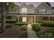 Charming townhome with brick facade, manicured landscaping, and inviting front porch at 5724 Cougar Ln, Charlotte, NC 28269