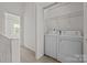 Conveniently located laundry area with a side by side washer and dryer at 5724 Cougar Ln, Charlotte, NC 28269