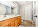 Double sink bathroom with wooden cabinets, a glass door shower, and a towel rack at 610 Mountain Pl, Albemarle, NC 28001