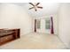 Spacious bedroom featuring vaulted ceilings and a fan fixture, with a window at 610 Mountain Pl, Albemarle, NC 28001