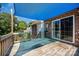 Wooden deck featuring a large blue sunshade, sliding glass door, and railings at 610 Mountain Pl, Albemarle, NC 28001