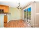 Dining area with hardwood floors, modern lighting, and sliding door to outdoor space at 610 Mountain Pl, Albemarle, NC 28001