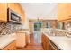Kitchen featuring stainless steel appliances, tile backsplash, and open view to living space at 610 Mountain Pl, Albemarle, NC 28001