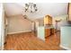 Open-concept living room connects to the kitchen, featuring hardwood floors and modern lighting at 610 Mountain Pl, Albemarle, NC 28001