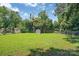 Green and spacious fenced-in backyard with ample room for recreation and relaxation at 6208 Karenstone Dr, Charlotte, NC 28215