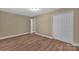 The spacious bedroom boasts stylish new floors and ample closet space at 6208 Karenstone Dr, Charlotte, NC 28215