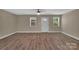 Sunlit living room offering neutral walls, modern flooring, and a welcoming atmosphere at 6208 Karenstone Dr, Charlotte, NC 28215