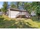 Backyard view of home with deck and stairs at 6515 Santa Cruz Trl, Charlotte, NC 28227