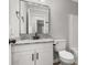 Well-lit bathroom featuring granite countertop, modern fixtures, and ample storage at 6515 Santa Cruz Trl, Charlotte, NC 28227