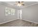 Bedroom features wood-look floors and natural light at 6515 Santa Cruz Trl, Charlotte, NC 28227