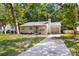 Charming single-story home with a well-manicured lawn and a driveway at 6515 Santa Cruz Trl, Charlotte, NC 28227
