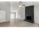 Open-concept room with vaulted ceilings, modern lighting and a stone fireplace at 6515 Santa Cruz Trl, Charlotte, NC 28227