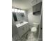 Bathroom features a vanity sink, updated lighting and new floors at 6517 Helens Way, Denver, NC 28037