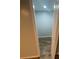 Narrow hallway with wood-look flooring and neutral paint at 6517 Helens Way, Denver, NC 28037