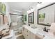 Bathroom featuring a double vanity with modern fixtures and a glass-enclosed shower at 7014 Walton Heath Ln, Charlotte, NC 28277