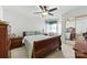 Bedroom featuring hardwood furniture, a ceiling fan, and a window at 7014 Walton Heath Ln, Charlotte, NC 28277