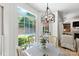Bright dining area with large windows overlooking the pool and patio area at 7014 Walton Heath Ln, Charlotte, NC 28277
