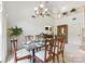 Elegant dining area with modern chandelier and staircase at 7014 Walton Heath Ln, Charlotte, NC 28277