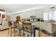 Open-concept kitchen with center island and seating for casual dining and entertaining at 7014 Walton Heath Ln, Charlotte, NC 28277