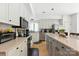 Well-lit kitchen features granite countertops, stainless appliances, and ample cabinet space at 7014 Walton Heath Ln, Charlotte, NC 28277