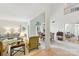 Bright, open-concept living area featuring large windows, neutral tones, and access to the dining room at 7014 Walton Heath Ln, Charlotte, NC 28277