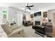 Comfortable living room with built-in shelves, fireplace, and access to outdoor patio at 7014 Walton Heath Ln, Charlotte, NC 28277
