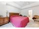 Spacious bedroom features a ceiling fan, carpet flooring, and ensuite bathroom at 7014 Walton Heath Ln, Charlotte, NC 28277