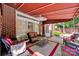 Covered patio with comfortable seating area at 7014 Walton Heath Ln, Charlotte, NC 28277